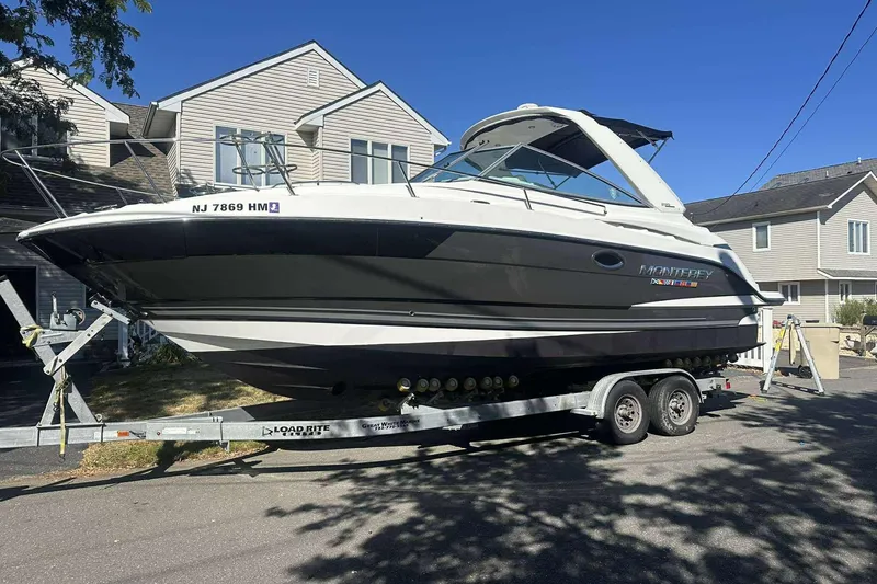 Slide: The Image of 2019 Monterey 295 Sport Yacht on trailer in residential driveway. - 3