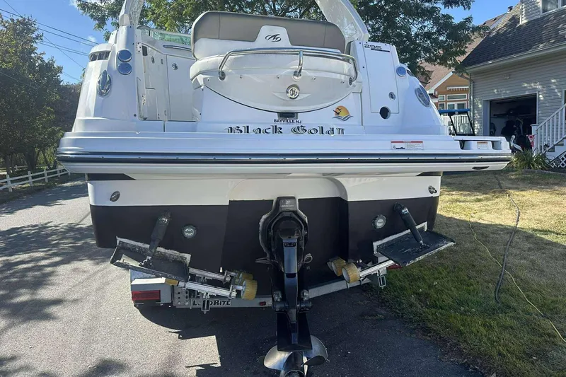 Slide: The Image of Rear view of a 2019 Monterey 295 Sport Yacht on a trailer in a residential area. - 8