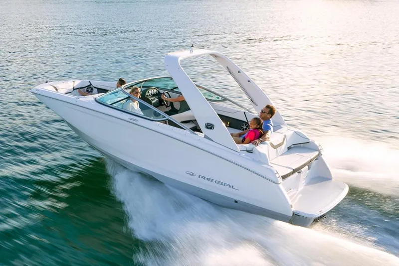Slide: The Image of Manufacturer Provided Image: 2020 Regal 22 FasDeck speedboat cruising on water with passengers. - 3