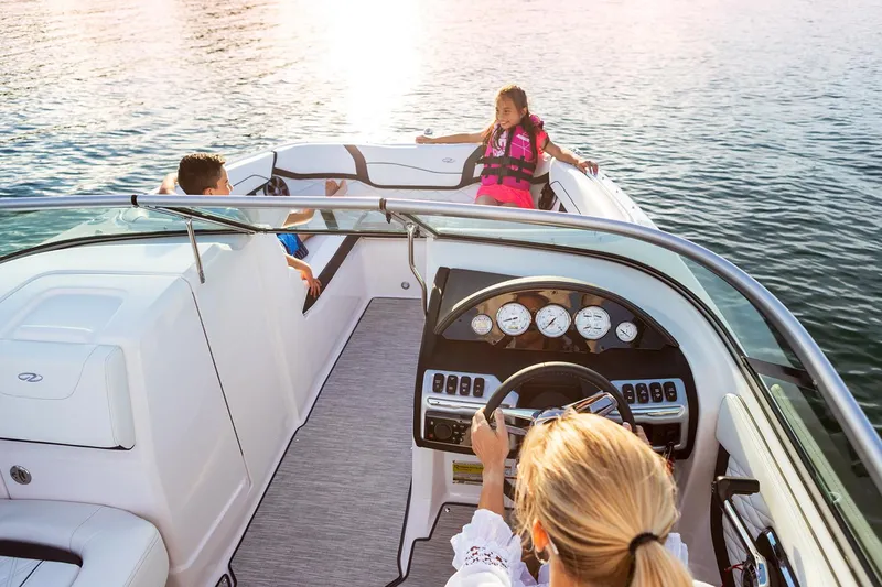 Slide: The Image of Manufacturer Provided Image: 2020 Regal 22 FasDeck boat on water with family enjoying the ride. - 5