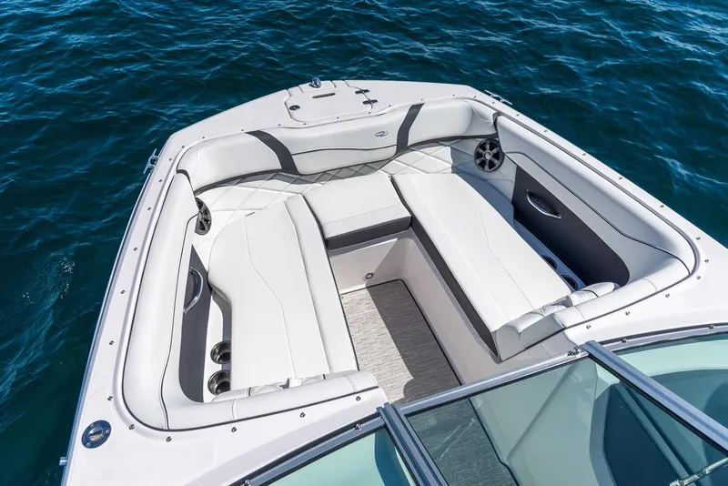 Slide: The Image of Manufacturer Provided Image: 2020 Regal 22 FasDeck boat interior with white seating on blue water. - 6