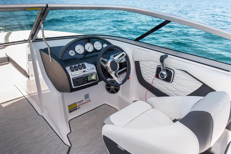 Slide: The Image of Manufacturer Provided Image: 2020 Regal 22 FasDeck boat cockpit with steering wheel and control panel. - 7