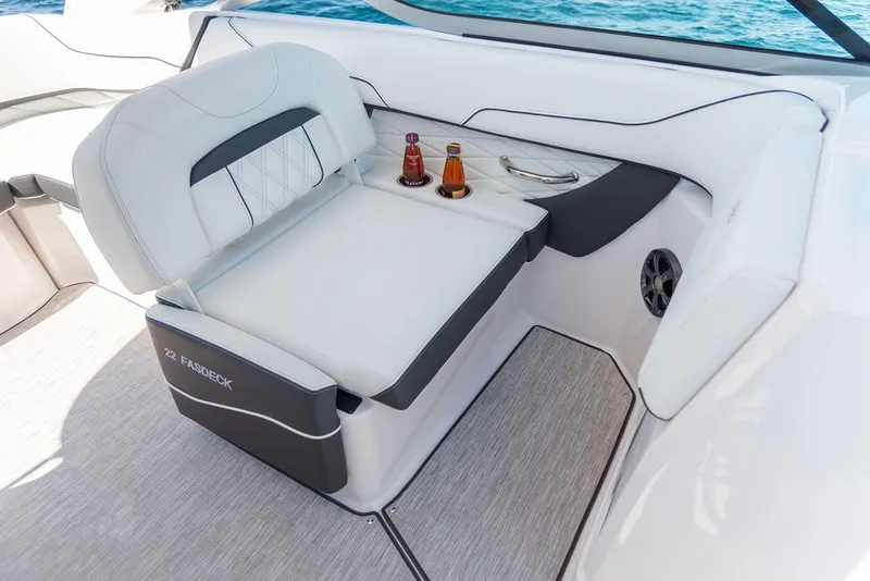 Slide: The Image of Manufacturer Provided Image: 2020 Regal 22 FasDeck boat interior with white seating and drink holders. - 8