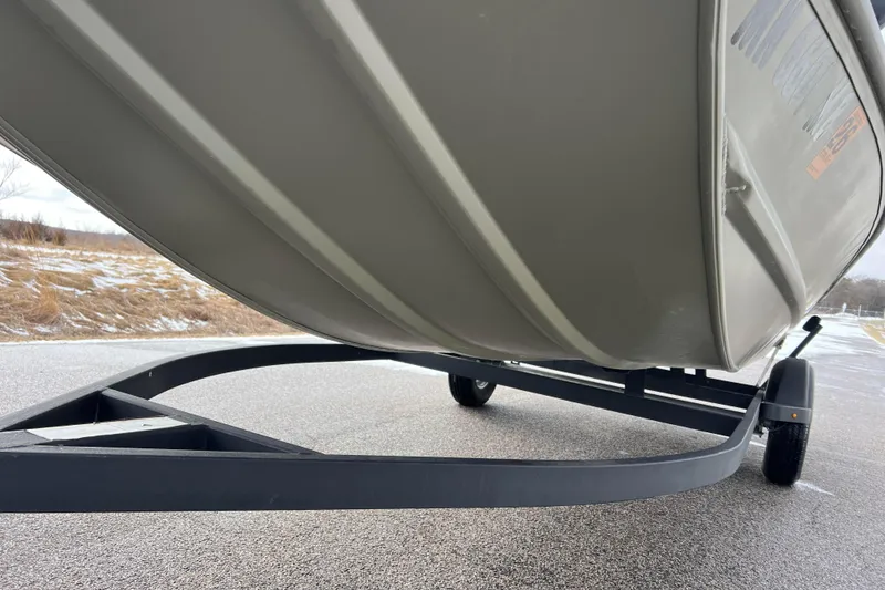 Slide: The Image of Underside of a 2021 Tracker Grizzly 1860 CC boat on trailer. - 10