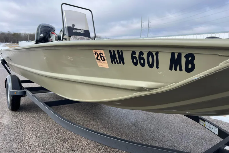 Slide: The Image of 2021 Tracker Grizzly 1860 CC boat on trailer. - 14