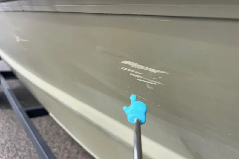 Slide: The Image of Scratches on a 2021 Tracker Grizzly 1860 CC boat hull. - 16