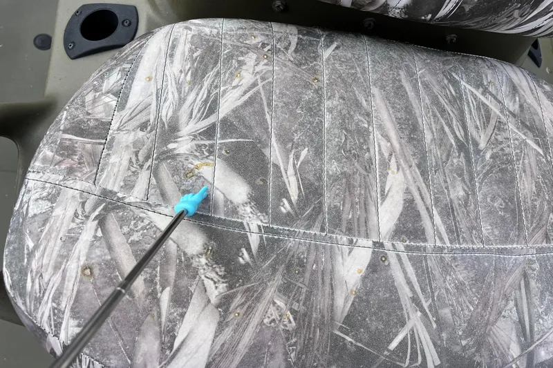 Slide: The Image of Close-up of Tracker Grizzly 1860 CC seat with camouflage pattern. - 25