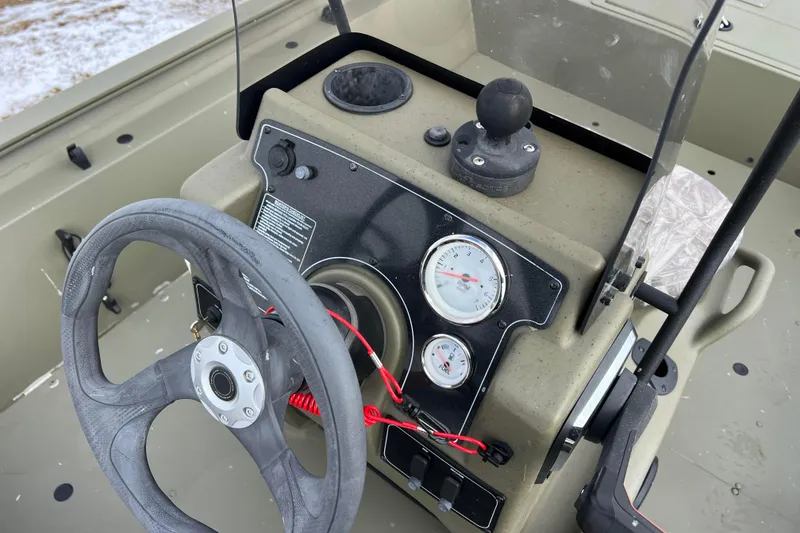 Slide: The Image of Dashboard of 2021 Tracker Grizzly 1860 CC boat. - 27