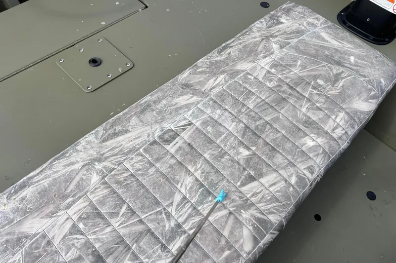 Slide: The Image of Tracker Grizzly 1860 CC 2021 seat cushion with gray pattern. - 31