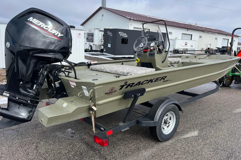 Slide: The Image of 2021 Tracker Grizzly 1860 CC boat with Mercury engine on trailer. - 4