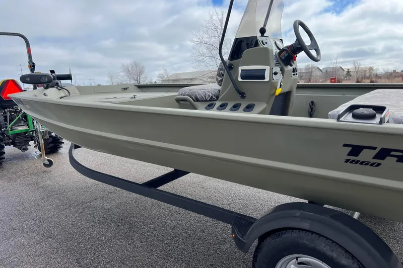 Slide: The Image of 2021 Tracker Grizzly 1860 CC boat on trailer. - 8