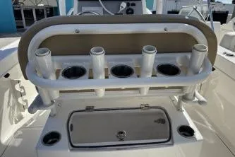 Slide: The Image of 2023 Trophy T24 CC boat with rod holders and storage compartment. - 6