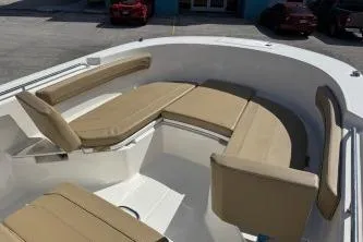 Slide: The Image of 2023 Trophy T24 CC boat with beige seating in the bow area. - 7