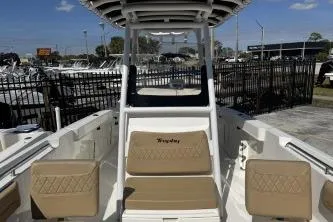 Slide: The Image of 2023 Trophy T24 CC boat interior with tan seating and center console. - 8