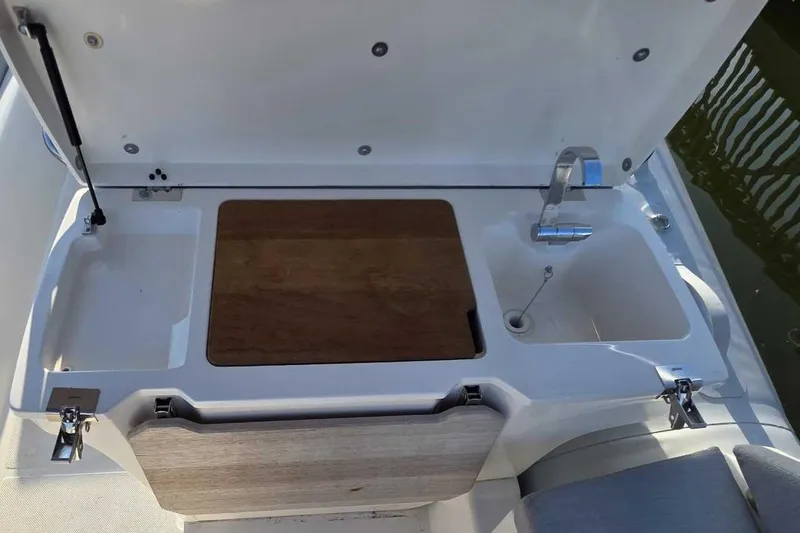 Slide: The Image of 2024 Zodiac N-ZO 680 boat interior with sink and cutting board. - 10