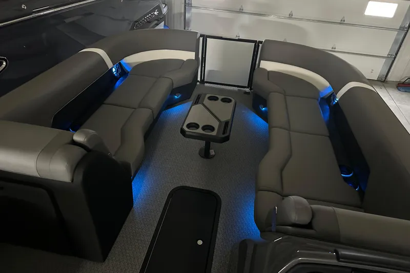 Slide: The Image of Luxurious interior of 2026 Evotti 525QL with sleek seating and ambient blue lighting. - 12