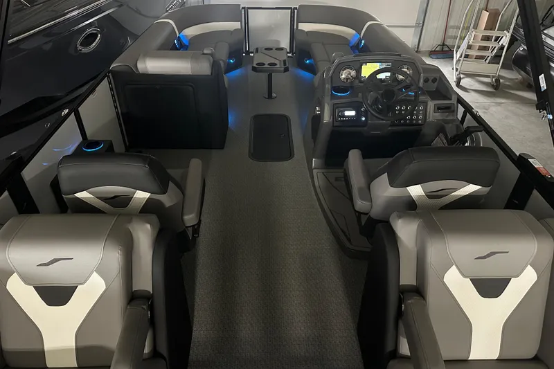 Slide: The Image of Luxurious interior of 2026 Evotti 525QL with ambient blue lighting and plush seating. - 13