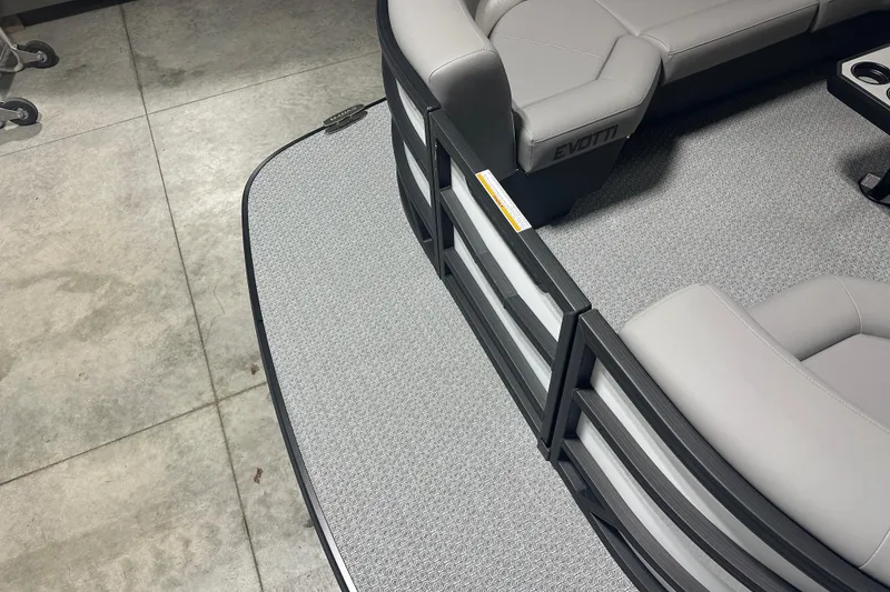 Slide: The Image of Luxurious interior of 2026 Evotti 525QL boat with sleek gray seating and cup holders. - 19
