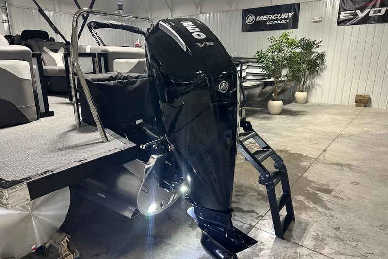 Slide: The Image of 2026 Evotti 525QL boat with a powerful V8 Mercury outboard engine in a showroom. - 3