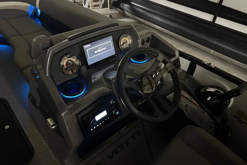 Slide: The Image of 2026 Evotti 525QL boat in showroom, featuring sleek design and LED lighting. - 8
