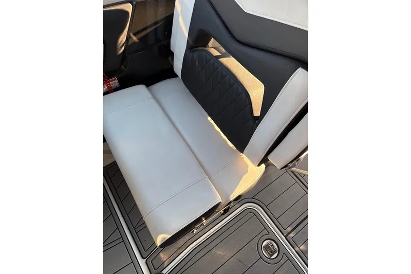 Slide: The Image of 2023 Monterey 298SS Super Sport boat seat with sleek white and black upholstery. - 13