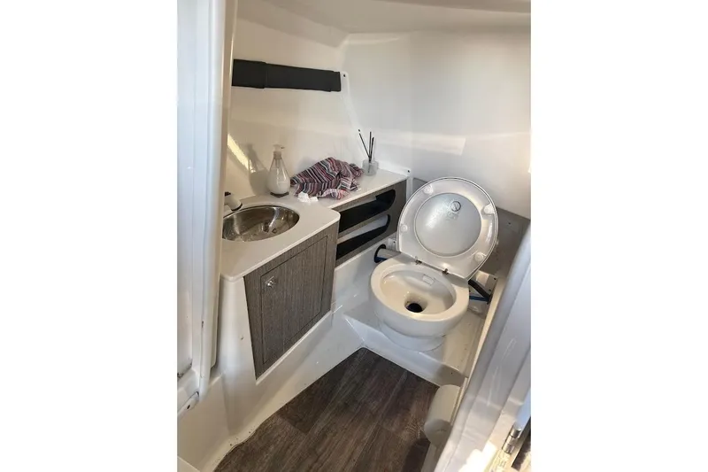 Slide: The Image of 2023 Monterey 298SS Super Sport boat bathroom with sink and toilet. - 14