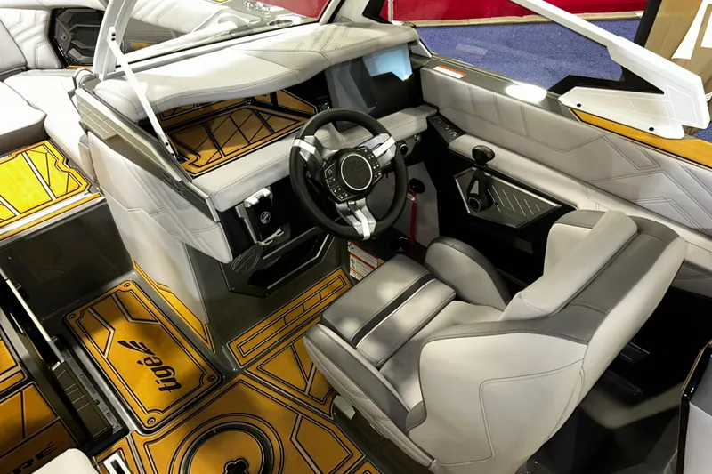 Slide: The Image of 2026 Tigé Ultré 23ZX boat interior with modern dashboard and luxurious seating. - 6
