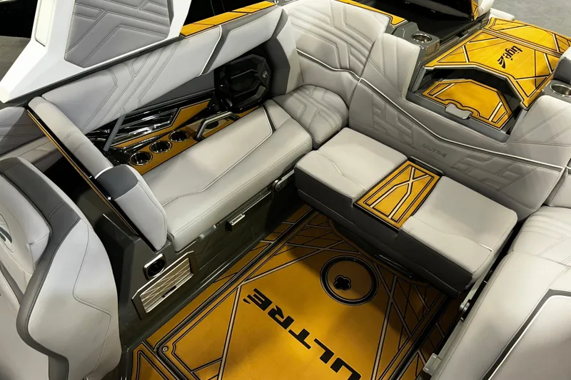 Slide: The Image of Luxurious interior of 2026 Tigé Ultré 23ZX boat with stylish seating and cup holders. - 7