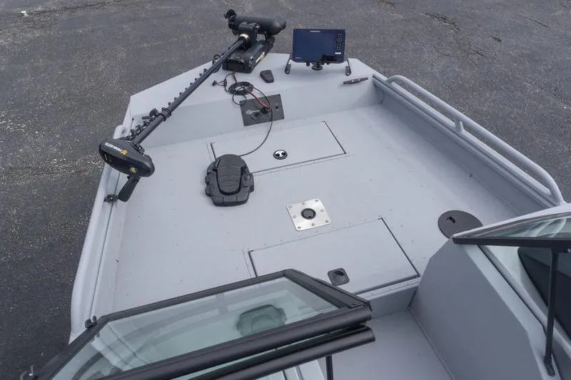 Slide: The Image of 2026 G3 Sportsman 2400 boat deck with trolling motor and navigation equipment. - 14