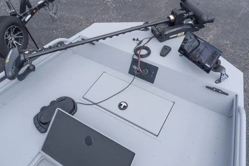 Slide: The Image of 2026 G3 Sportsman 2400 boat deck with Minn Kota trolling motor and control panel. - 15