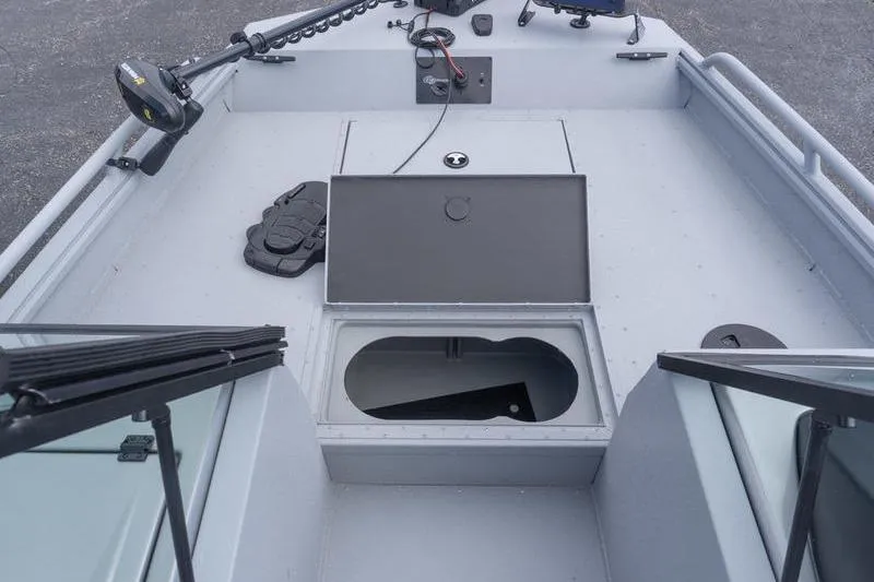 Slide: The Image of 2026 G3 Sportsman 2400 boat interior with storage compartments and fishing equipment. - 18