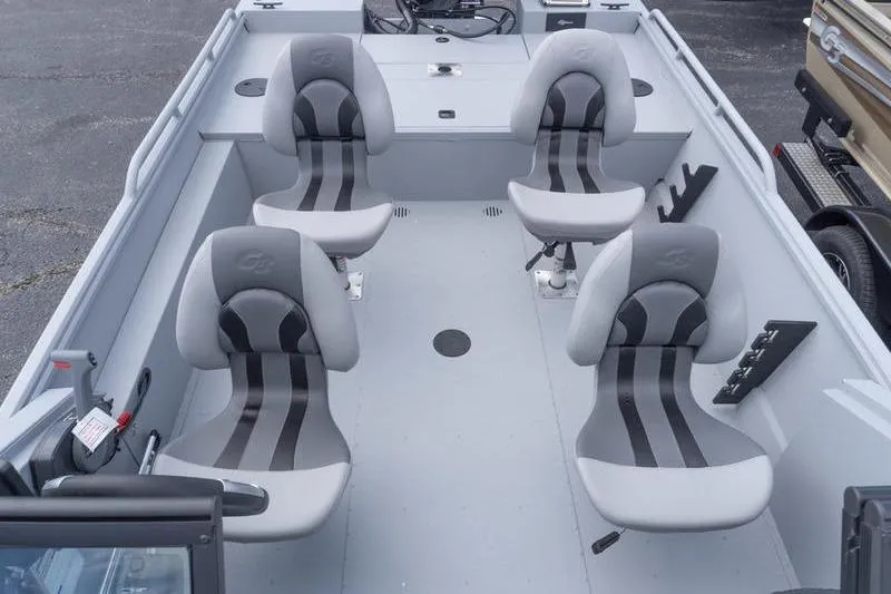 Slide: The Image of 2026 G3 Sportsman 2400 boat interior with four cushioned seats and fishing rod holders. - 20