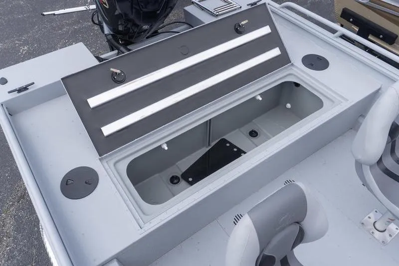 Slide: The Image of 2026 G3 Sportsman 2400 boat interior with open storage compartment and seating. - 22