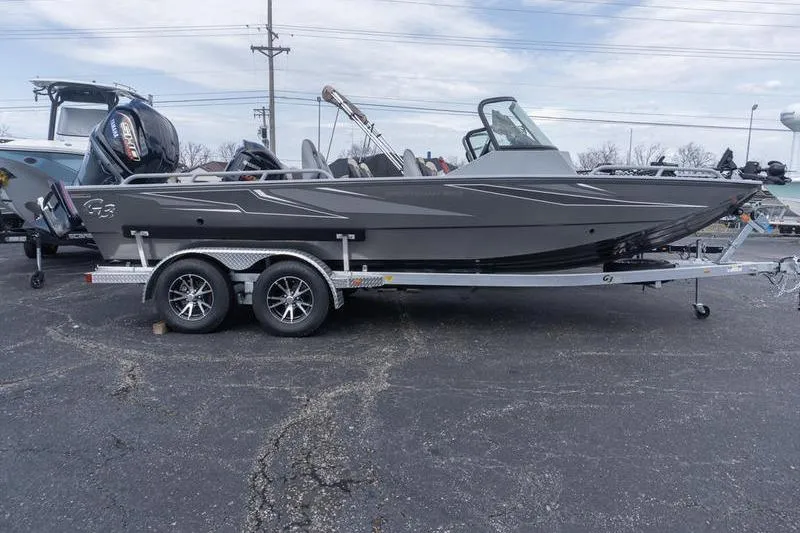 Slide: The Image of 2026 G3 Sportsman 2400 boat on trailer, parked outdoors. - 3