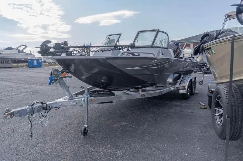 Slide: The Image of 2026 G3 Sportsman 2400 boat on trailer in parking lot. - 4