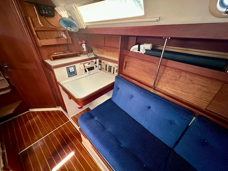 Slide: The Image of Interior of a 1987 Catalina 34 yacht with blue upholstery. - 13