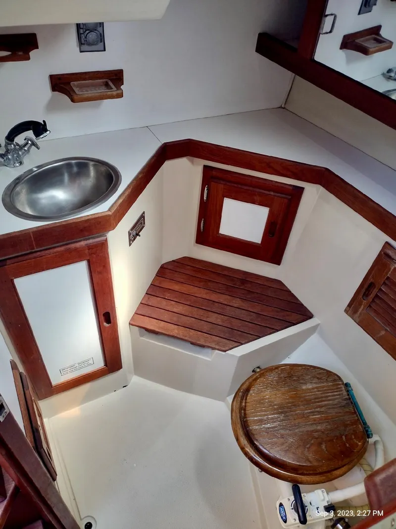 Slide: The Image of Interior of a 1987 Catalina 34 yacht with wood trim. - 21