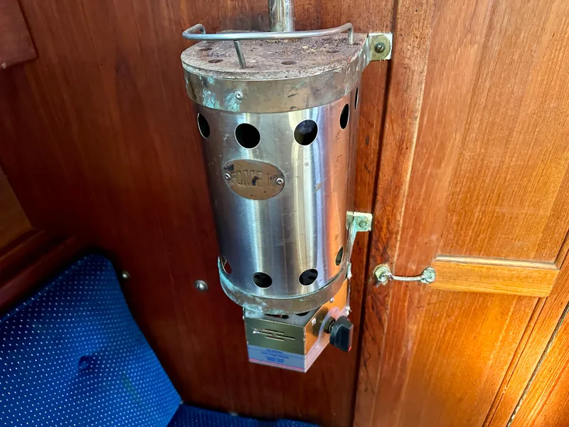 Slide: The Image of Metal heater in a 1987 Catalina 34 yacht interior. - 23