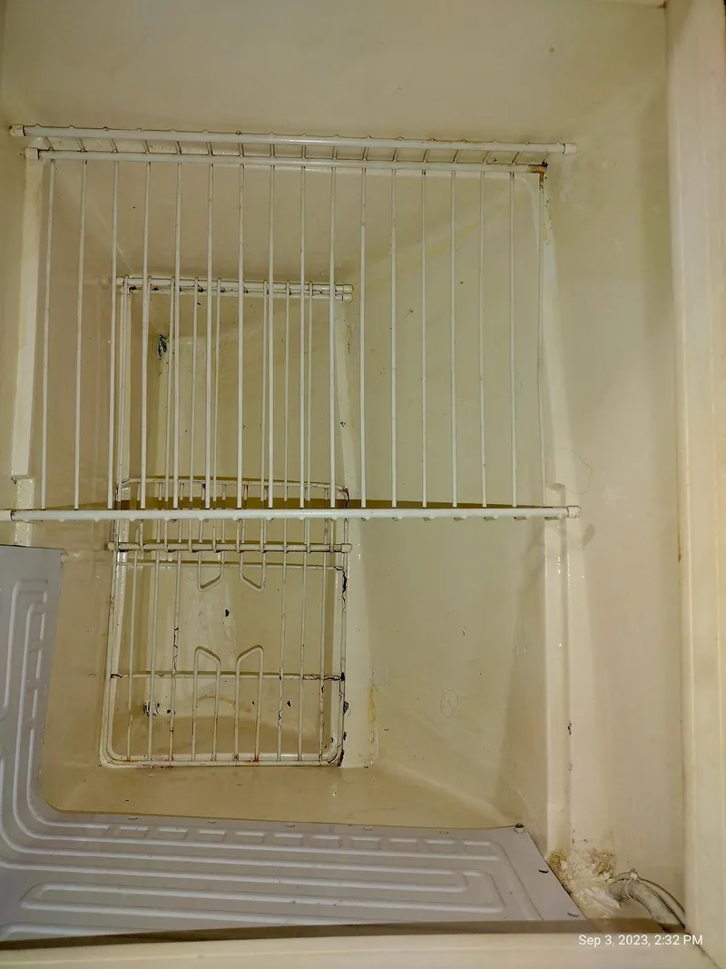 Slide: The Image of Interior of a 1987 Catalina 34 refrigerator. - 27