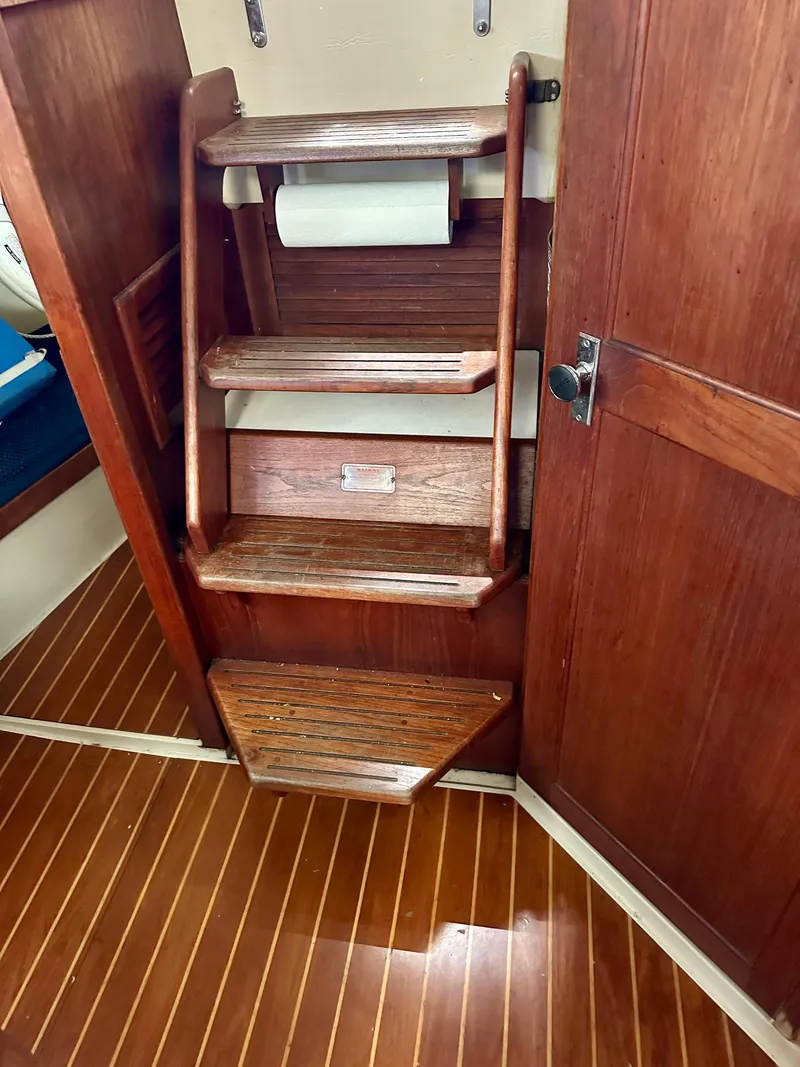 Slide: The Image of Wooden stairs in a 1987 Catalina 34 yacht. - 7