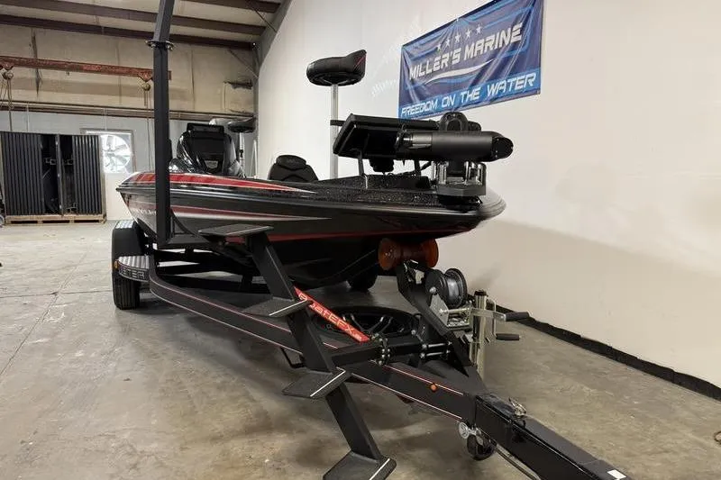 Slide: The Image of 2022 Skeeter ZX150 boat on trailer in indoor showroom. - 3