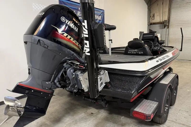 Slide: The Image of 2022 Skeeter ZX150 boat with Yamaha engine in a garage setting. - 5