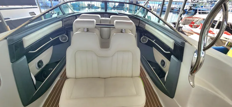 Slide: The Image of Interior of a 2007 Cobalt 343 boat with white leather seating. - 14