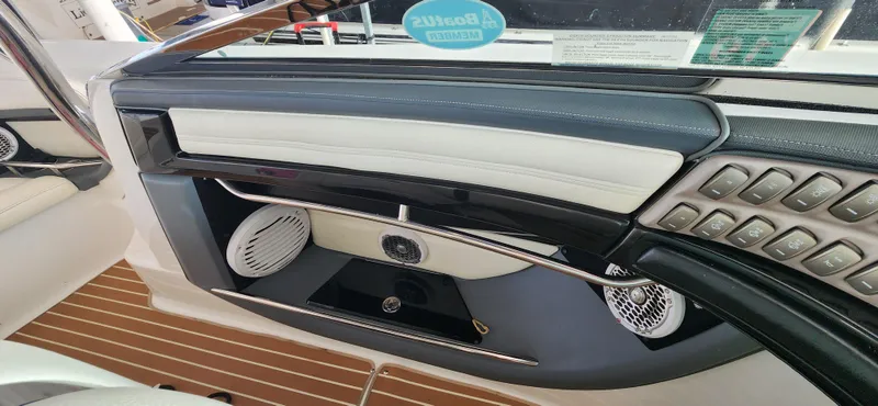 Slide: The Image of Interior of a 2007 Cobalt 343 boat with sleek dashboard and wood flooring. - 18