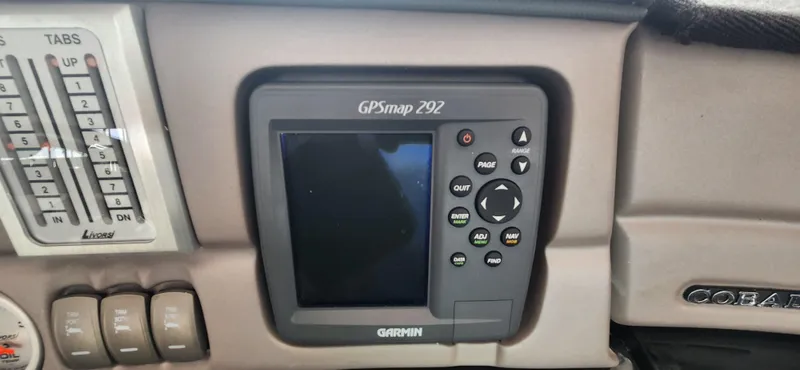 Slide: The Image of Garmin GPSmap 292 on 2007 Cobalt 343 dashboard, featuring navigation controls and display. - 19