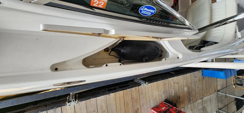 Slide: The Image of 2007 Cobalt 343 boat interior with seating and storage compartment. - 21
