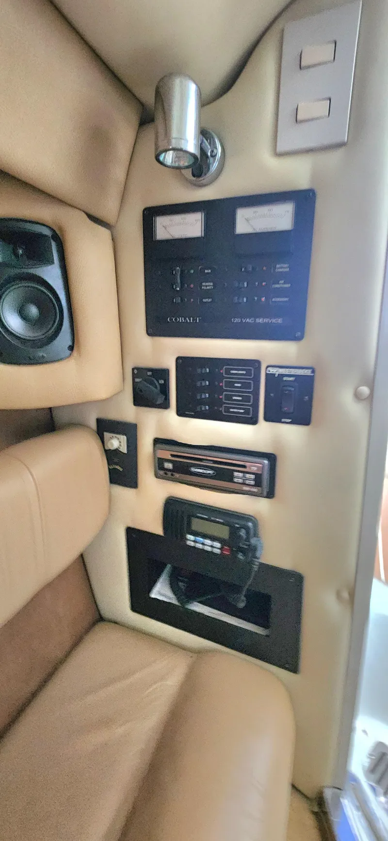 Slide: The Image of Control panel of a 2007 Cobalt 343 boat with beige interior and audio system. - 27
