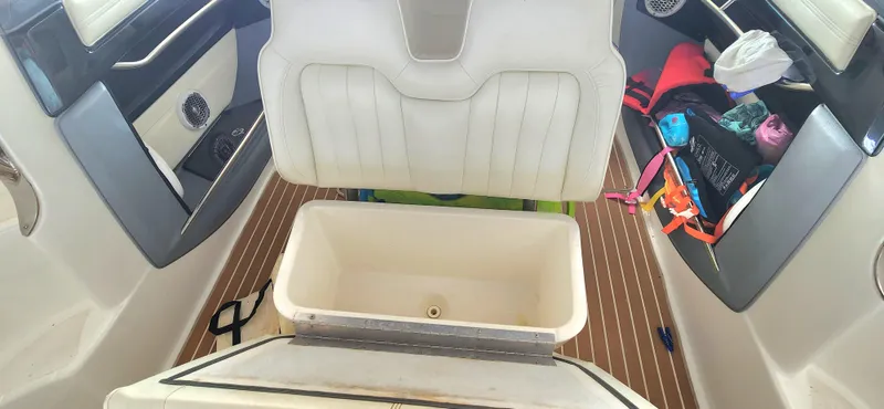 Slide: The Image of Interior of a 2007 Cobalt 343 boat with open storage compartment. - 30
