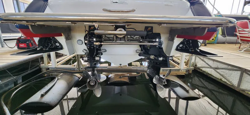 Slide: The Image of Rear view of a 2007 Cobalt 343 boat showing dual propellers and exhaust system. - 36