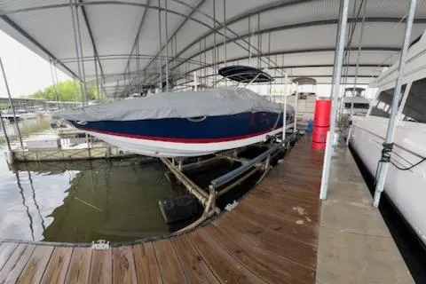 Slide: The Image of 2007 Cobalt 343 boat covered and docked in a marina. - 41